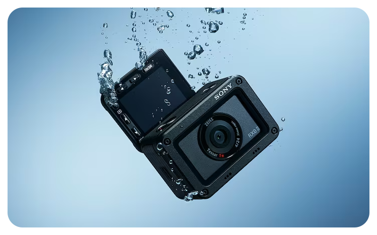 Sony RX0 II Camera sinking in water with the screen extended to show its waterproof capabilities